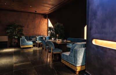 Elegant seating area with blue sofas at AMARU Dubai, Dubai, UAE
