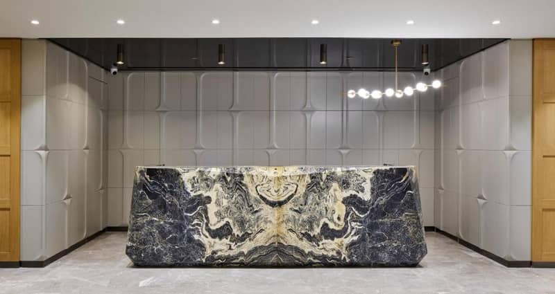 Lamartine Hotel - a lobby with a marble table in the middle at Lamartine Hotel in Istanbul