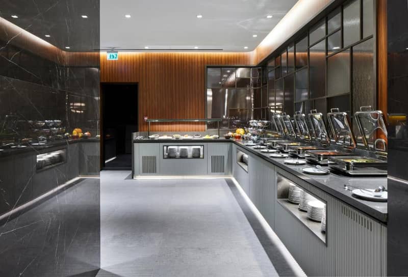 Lamartine Hotel - a kitchen with a counter with dishes on it at Lamartine Hotel in Istanbul