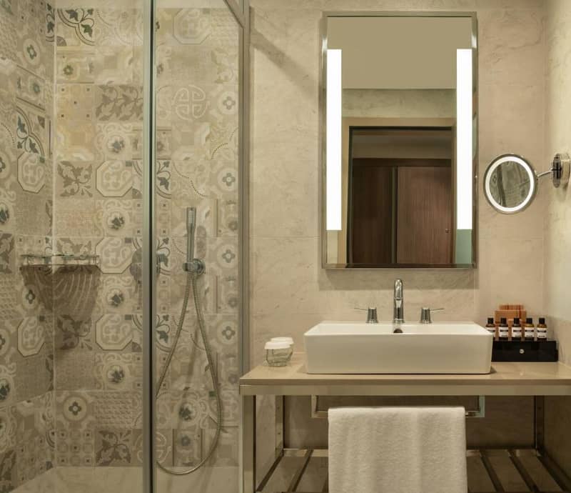 Mövenpick Hotel Istanbul Asia Airport - a bathroom with a sink and a shower at Mövenpick Hotel Istanbul Asia Airport in Istanbul