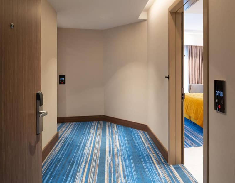 Mövenpick Hotel Istanbul Asia Airport - an empty room with a door leading to a bedroom at Mövenpick Hotel Istanbul Asia Airport in Istanbul