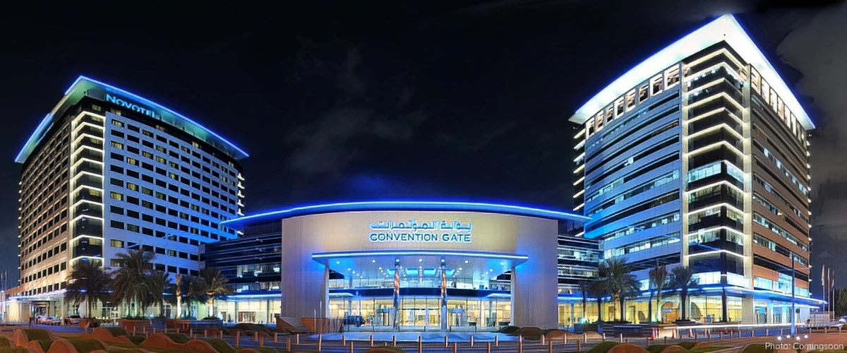 Dubai World Trade Centre illuminated at night, Dubai skyline backdrop.
