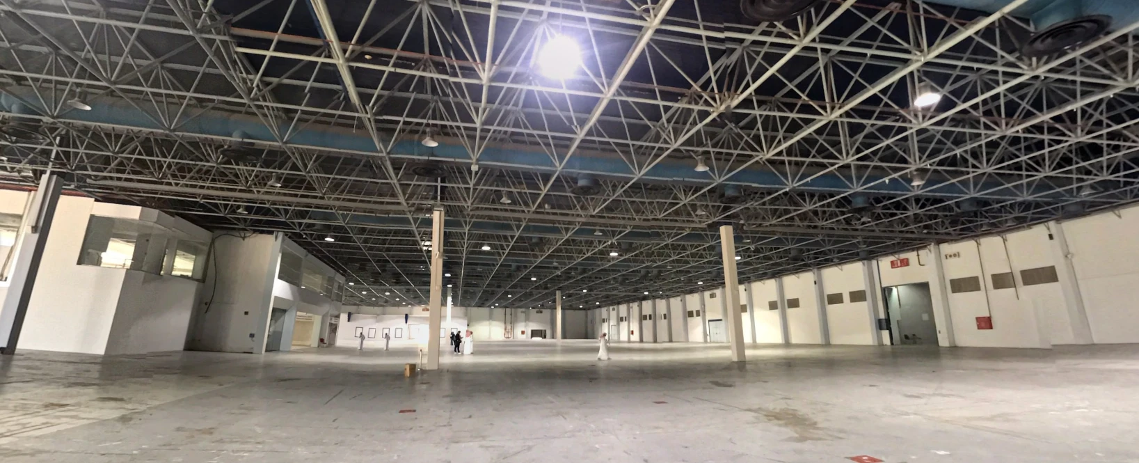 Empty exhibition hall with high ceiling at Jeddah Convention Center.