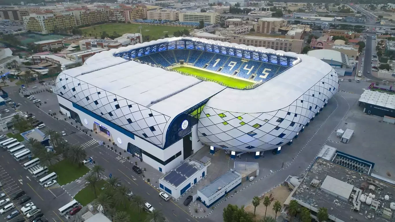 Aerial view of Al Nasr Al Maktoum Stadium, Dubai, modern architecture.